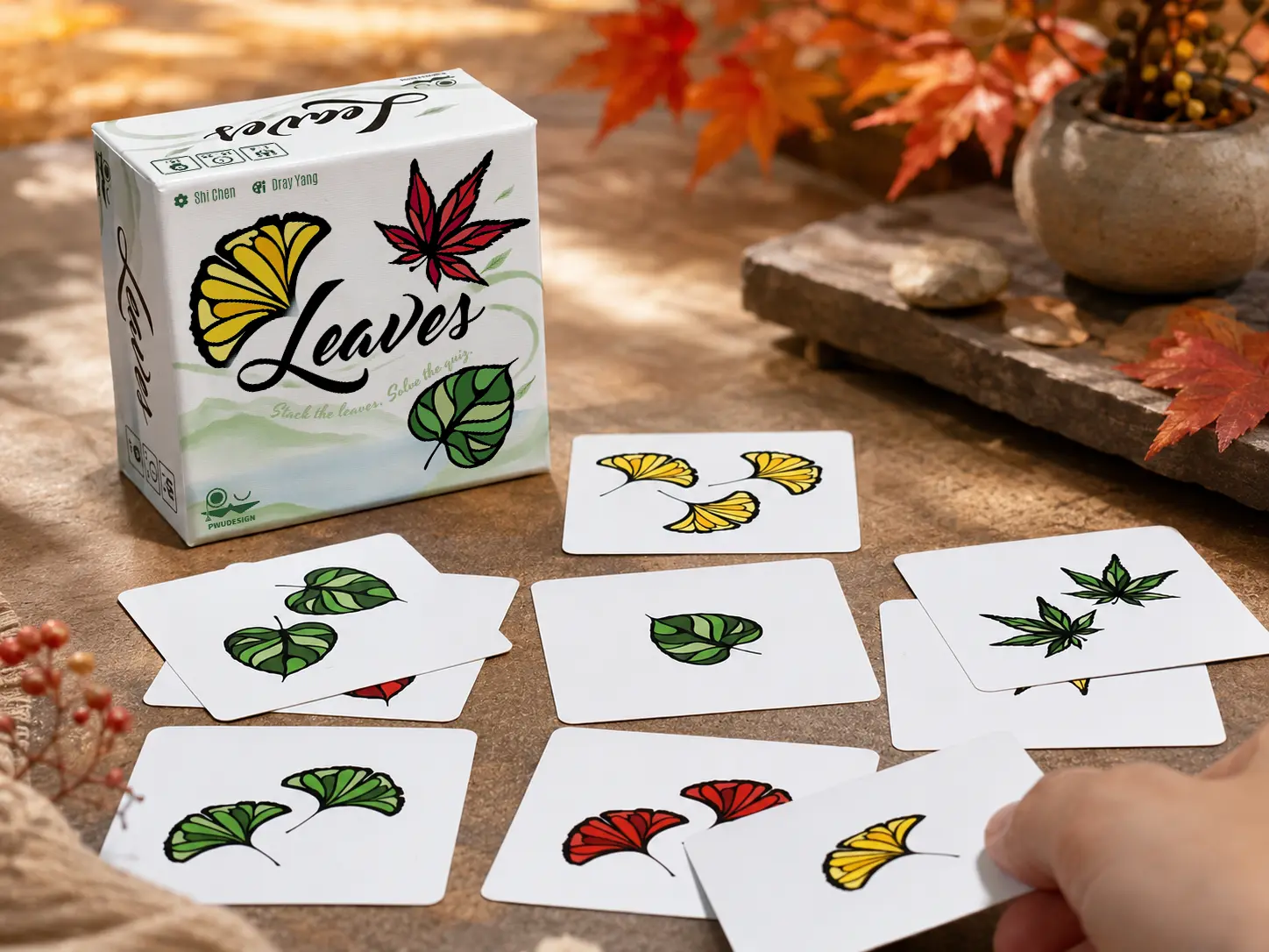 Leaves game and leaf-pattern cards on an autumn-inspired tabletop